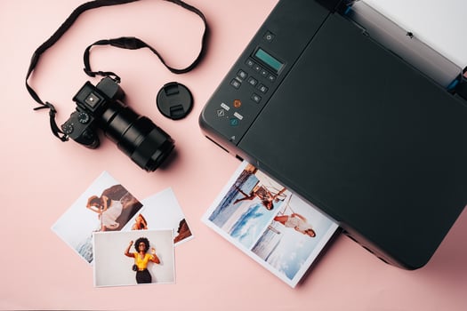 Printer and photo camera on table. Printing photos concept