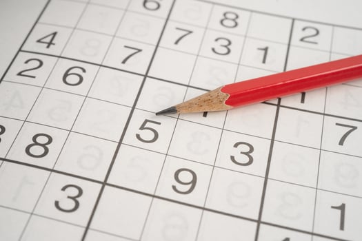 Sudoku puzzle game playing to challenge brain. photo