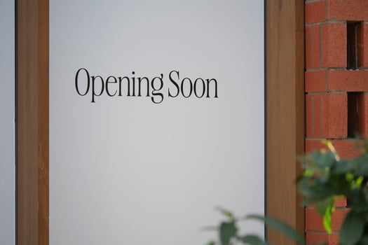 Exciting Storefront Announcement We Will Be Opening Soon with Signage Displayed photo