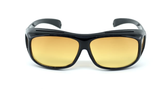 Classic Black Sunglasses With Stylish Yellow Tinted Lenses on White Background photo