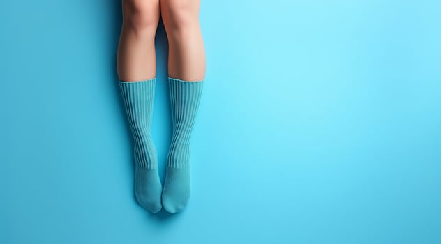 Knitted things, socks on feet, created using technology. photo