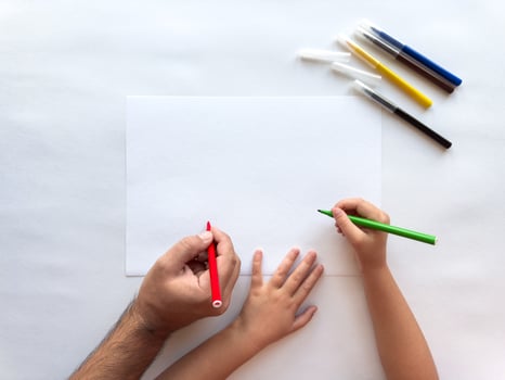 Artistic bonding. Parent and child drawing creative expressions together photo