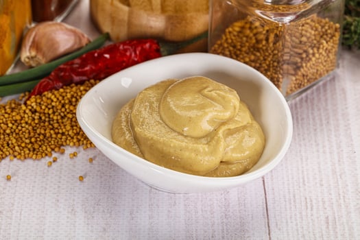 Dijon mustard sauce in the bowl photo