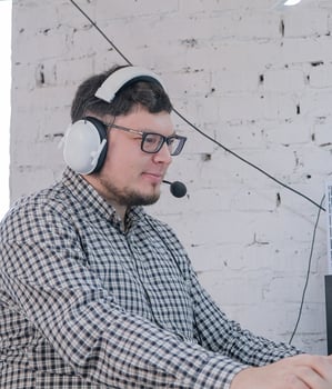 Man Working from Home on Laptop Computer in Stylish Loft Apartment photo