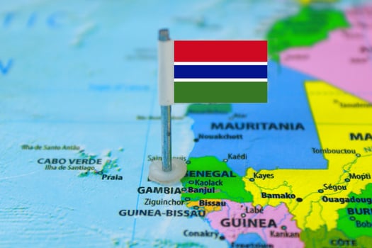 Gambia Flag Over World Map, Selectiove Focus photo