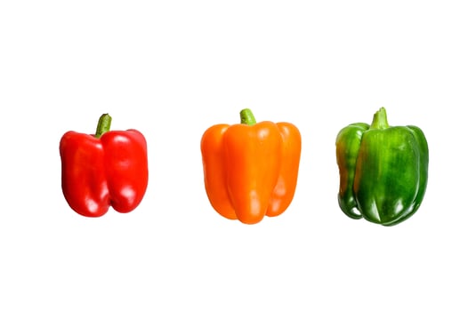 Green, orange and red bell peppers. Isolated on white background. photo