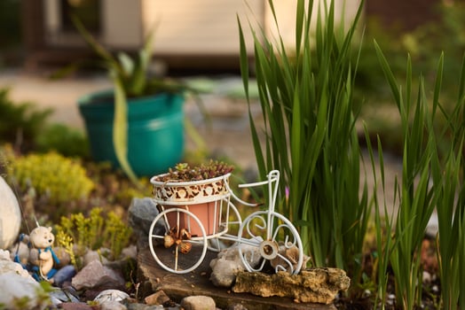 A Charming Miniature Bicycle Planter That Enhances Any Garden Landscape Beautifully photo