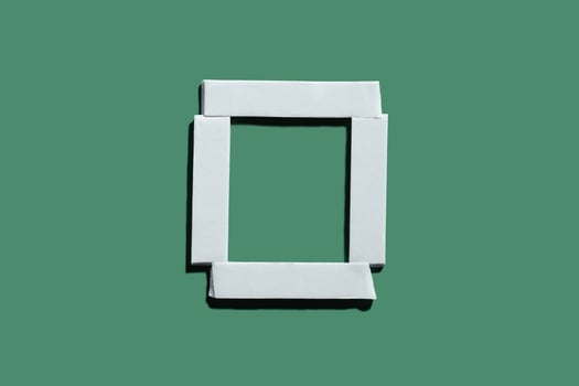 Double sided tape frame on green background. Design element for holiday sale banner photo