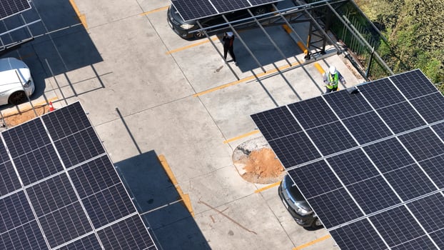 A parking lot with solar panels on top photo