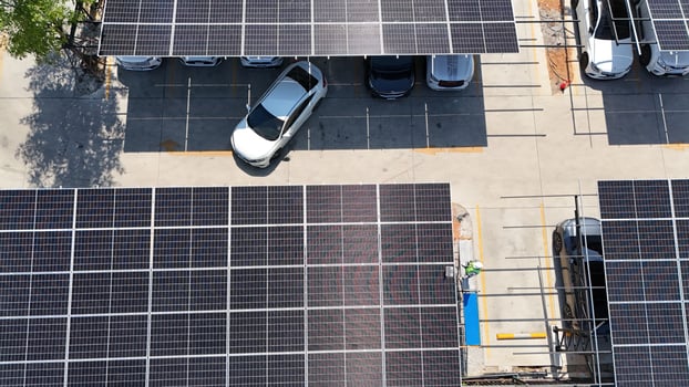 A parking lot with solar panels on top photo