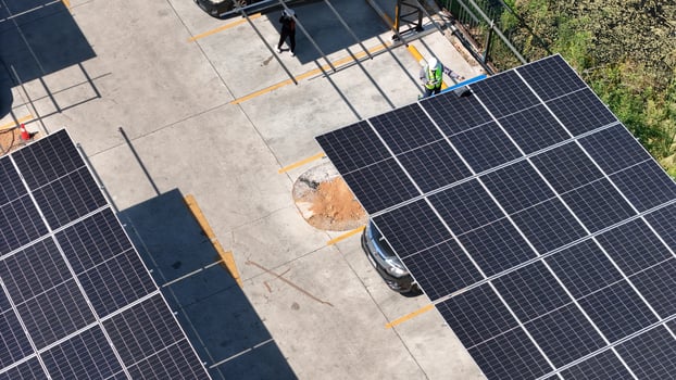 A view of solar panels on a parking lot photo