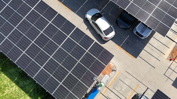 A car parked in a parking lot with solar panels photo