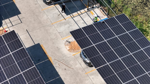 A view of solar panels on a parking lot photo