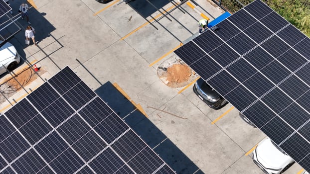 An overhead view of a parking lot with solar panels photo