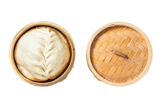 Pyanse steamed bun in a Bamboo steamer, korean street food. Isolated, white background. photo