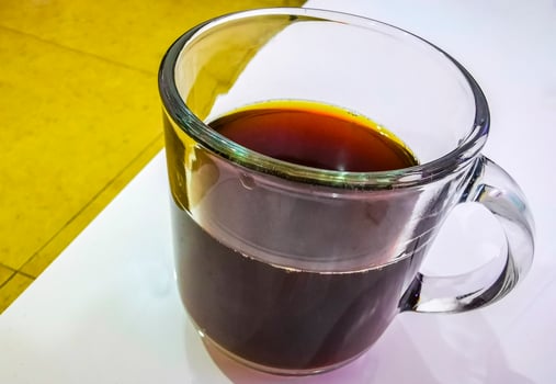 Glass with black coffee on the table in Cancun Mexico. photo