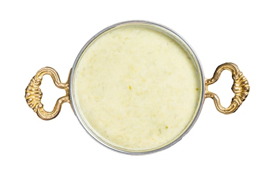 Vichyssoise French cream soup with leek, potato and onion. Isolated, white background. photo