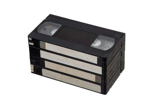 Pile of VHS cassettes. Vintage media. Isolate on a white back. photo