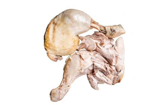 Boiled chicken leg thigh on a wooden board with herbs. Isolated, white background. photo