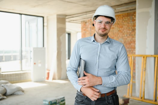 Man builder. Architect at construction site photo