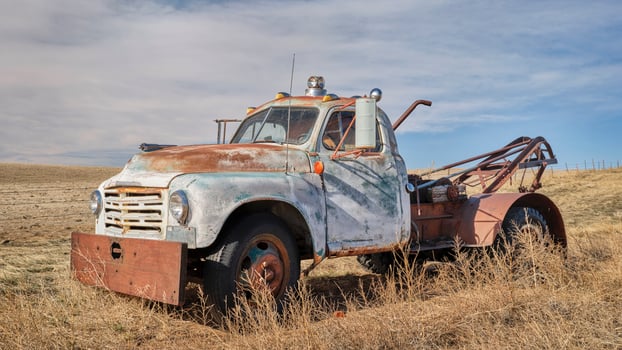 old rusty towing truck on a prairie photo