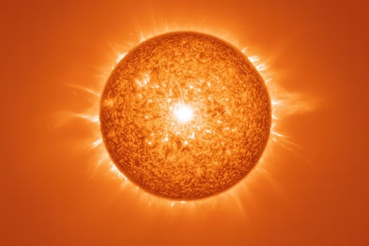 Fiery sun in orange sky photo