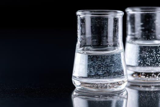 Sparkling water glasses on black background photo
