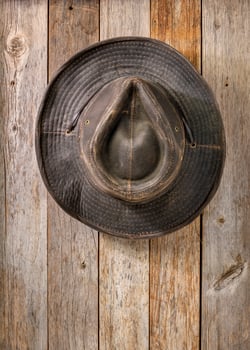 weathered outback oilskin hat on barn wood photo