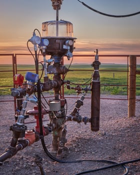 detail of oil well head with pump-jack photo