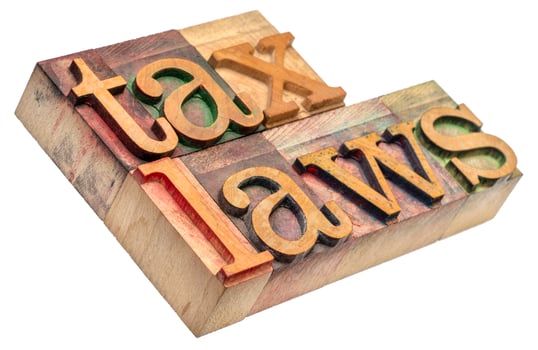 tax laws word abstract in wood type photo