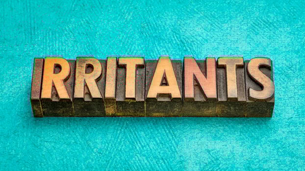 irritants word abstract in vintage letterpress wood type photo