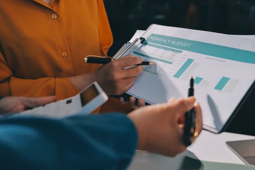 Business people working with financial documents photo