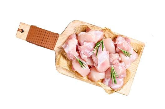 raw chicken fillet cut into cubes with spices. Isolated on white background. Top view. photo