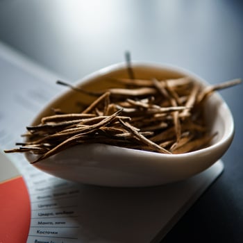 Elegant Bowl Filled with Natural Decorative Sticks for a Chic Aesthetic Home Decor photo