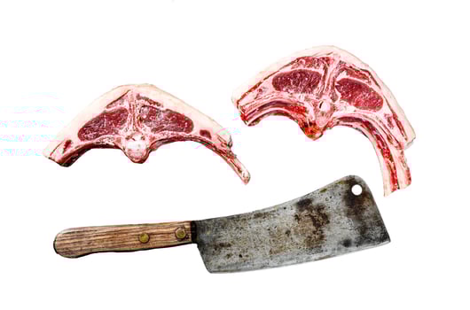 Raw lamb cutlets fresh cut with meat cleaver. Isolated on white background. Top view. photo