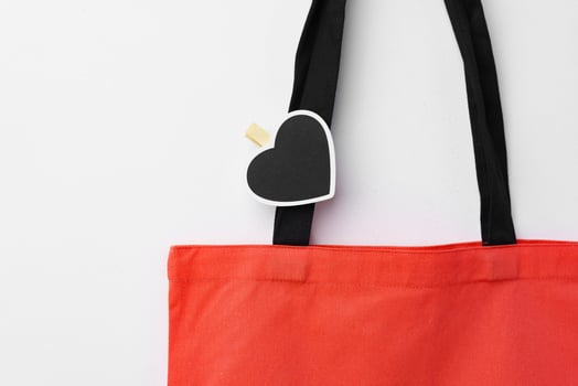 Cotton tote shopper bag with heart tag on white background photo