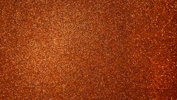 Orange shiny background with foamiran. Decorative foam material with glitter for crafts photo