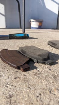 Checking Car Brake Pads on a Concrete Surface in a Detailed Closeup Composition and Design photo