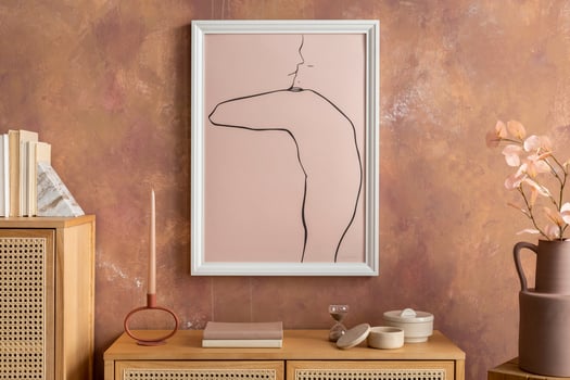 Creative composition vintage living room with rattan chest of drawers, dried flowers, bowl, ladder and minimalistic poster. Stylish accessories. Mock up poster. photo