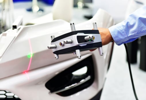Hand-held 3D laser scanners measure the accuracy of automotive parts. in industrial plants photo