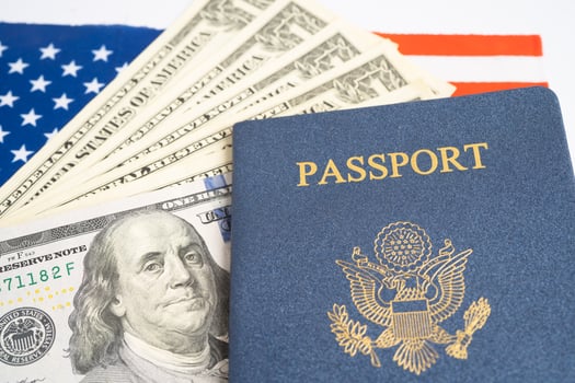 US passport issued to citizen and national of the United States of America to travel in most countries outside with USA flag and dollar money. photo