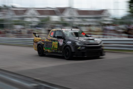 Songkhla, Moung, Thailand Oct 19, 2024 PT Maxnitron Motorsport, Capture thrill of motorsport with dynamic image of high-speed racing car, expertly navigating track photo