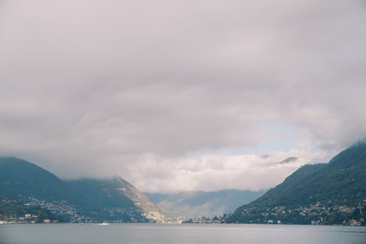 Fog descends from the mountain ridge of the Lake Como coast. Italy photo