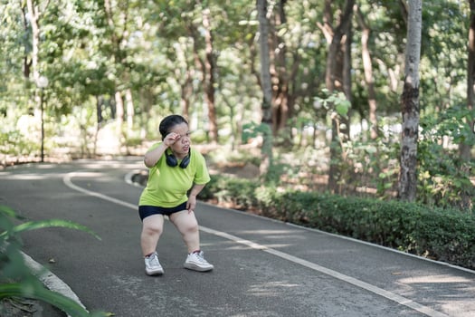 Empowered Young Woman with Disability Jogging in Park for Fitness and Wellbeing photo