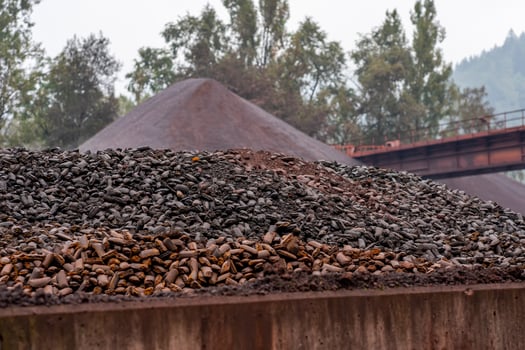 Site at a mining processing plant. A pile of stones photo