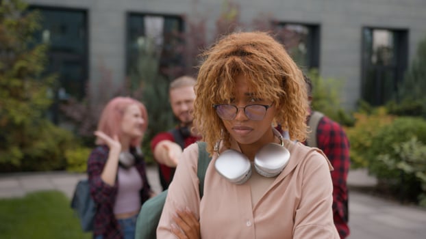 Group multiracial students teens classmates showing thumb down mock abused humiliate bully Caucasian student woman bullied sad upset victim girl mockery high school bullying university college cruel photo