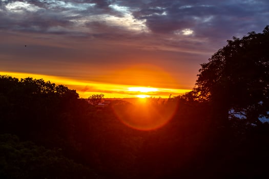 Sunrise with intense natural orange lights and idyllic dramatic scenery photo