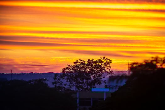 Sunrise with intense natural orange lights and idyllic dramatic scenery photo