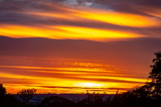 Sunrise with intense natural orange lights and idyllic dramatic scenery photo