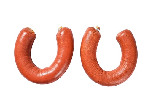 Turkish sucuk sausage, Sujuk dry spicy sausage. Isolated on white background, top view. photo